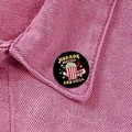 Black round enamel pin with Horror Movies and Chill design on pink denim jacket - Horror Movies and Chill (XZ8914)