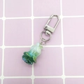 Creative gradient cabbage resin keychain with silver lobster clasp on a grid surface - Cabbage/Green-Purple