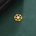 Detailed close-up of 18K gold-plated stainless steel ship wheel pendant charm on green background - Ship Helm Hexagonal Spoke Style / Gold