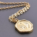 Golden stainless steel round pendant necklace with engraved handprint and footprint - Set (Pendant + Necklace) / Gold