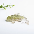 Fish figurine ornament made of transparent resin with green and gold crystal stones - Peridot