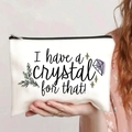 Detail of white canvas cosmetic bag with crystal print and secure black zipper closure - I Have A Crystal White (jiaying0043)