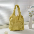 Minimalist yellow waffle texture tote bag with stylish bubble fabric design on white sill - Yellow