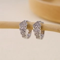 Silver V-shaped hoop earrings with micro-pave zircon inlay on a minimalist wooden stand - V-shaped Multi-row Pavé Huggie-Silver