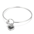Silver stainless steel bracelet featuring a black heart charm and a smooth round bead - Silver Black Heart Bracelet (KB165591-Z)