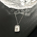 Silver titanium necklace featuring a white shell rabbit pendant on a sleek square plate - Silver