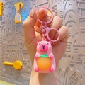 Cute pink cartoon capybara keychain with orange charm and matching plastic clasp - Glowing Capybara - Pink