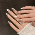 Detail of pink cat-eye press-on nails with 3D flower carvings and pearl accents - Extra Small (XS) / Medium Coffin