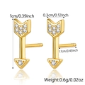 Macro view of gold-plated arrow stud earrings with clear crystals and product dimensions - Arrow