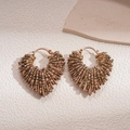 Detail of vintage heart-shaped beaded hoop earrings with bronze metallic wire weave - Light Coffee