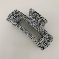 Detail view of large rectangular hair claw clip with black and white dotted texture - Large Rectangle / Black