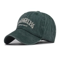 Detailed close-up of dark green washed cotton baseball cap with white vintage embroidery - Washed Dark Green