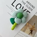 Pale blue quilted flower charm with green stem on artistic background magazines - Accessory Small Green Flower