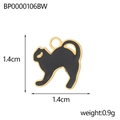 Detail view of a black enamel cat pendant with gold edges including size measurements - Black Little Cat