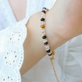 Beaded bracelet with white crystal, tiger eye stone and gold metallic accents - Gold Beaded Style (E393)
