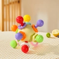 Baby Manhattan teether ball in pale yellow with colorful textured sensory nubs - Round Ball - Yellow