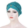Dark green turban headwrap with braided detail and golden beads on white model - Teal