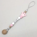 Detail of baby pacifier chain with beech wood, crown bead, and BABY letter beads - Pink