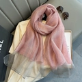 Detail of pink silk scarf with glitter effect and gray mesh trim on a fashion setting - Grey Pink