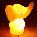 Cute elephant night light with warm orange glow on soft mesh fabric and pearls - Yellow Elephant