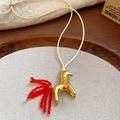 Golden horse pendant necklace with vibrant red bead tail and minimalist white cord - 24# Necklace Gold Red Bead Tail
