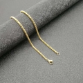 Macro shot of gold-plated box chain necklace with a secure lobster clasp on black display - Gold 3mm*60cm Chain