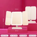 Beige LED tri-fold makeup mirror with adjustable brightness and storage base - Large Frosted Rechargeable