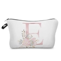 Close-up detail of white makeup bag featuring a pink letter E with elegant floral pattern - Letter E Style