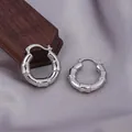 Elegant silver bamboo joint hoop earrings with high polish finish on satin background - E-044---Platinum