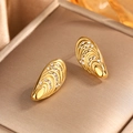 Macro shot of 18k gold plated shell-shaped earrings with sparkling white crystals - Fan Shaped Ripple / Gold Spiral + Rhinestone