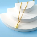 Elegant gold drop pendant necklace on a minimalist stand with a clear sky blue backdrop - Letter I(I)