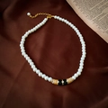 Detail of vintage French choker necklace with white pearls, black enamel and gold accents - Gold Pearl Necklace