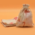Beige cotton drawstring sachet bag featuring pink flamingo prints with extra flat bags - White Flamingo