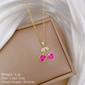 Macro detail of gold cherry necklace with pink crystal heart and product dimensions - Cherry Heart Pendant Necklace (C453)