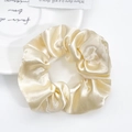 Elegant champagne satin scrunchie with silk luster on a minimalist white backdrop - Off-white (Large)