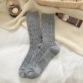 Chic grey knitted wool socks with cable pattern in a cozy lifestyle setting - One Size / 453 Light Grey