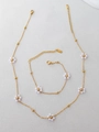 Detail of beaded flower jewelry set with stainless steel necklace and bracelet - Pearl Necklace And Bracelet