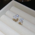 Close-up of elegant silver pearl earrings with zircon inlay in a beige jewelry box - Clustered Pearl Zirconia Ring (2#)