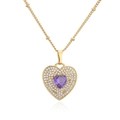 Macro detail of 18K gold-plated necklace featuring a purple zircon heart and pave crystals - Gold Heart Purple Zirconia