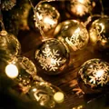 LED Christmas ball string lights with snowflake and reindeer patterns in warm white - 1.5m 10 LEDs Steady Battery Gold Electroplated Balls