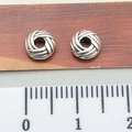 Silver tibetan-style spacer beads for DIY bracelets showing diameter size on a ruler - Volleyball Stripe Spacer Bead