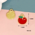 Detail view of 13mm apple alloy pendants with red enamel and golden textured back - Apple-Gold