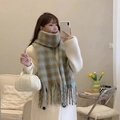 Blue and brown plaid scarf with tassels styled with a white handbag in a cozy home setting - Blue Brown Plaid (22)