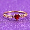 Rose gold infinity ring featuring a heart-shaped red gemstone and white diamond accents - KC Gold Red Infinity Heart