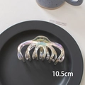 Detail shot of a 10.5cm holographic laser shark hair clip on a black minimalist tray - 13# Octopus-10.5cm