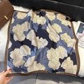 Detailed texture of silk square scarf with floral print on plush background - Blue (W-472-Blue)