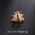 Golden beetle insect brooch featuring champagne crystals and a tiger eye stone - Coffee Rhinestone Beetle