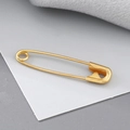 Imperdible de acero chapado en oro de 18K para puños y cuellos en acabado dorado - Dorado
