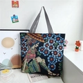 Ethnic style canvas tote bag featuring vibrant floral prints and striped top handles - Style 1 (Woman with Blue Flowers)