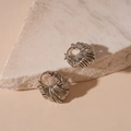 Detail of silver twisted weave texture hoop earrings on white marble stone - Coil U-shaped Ear Clip / Silver